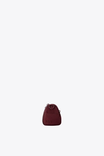 The Expandable Crossbody Charm in Burgundy - Image 7